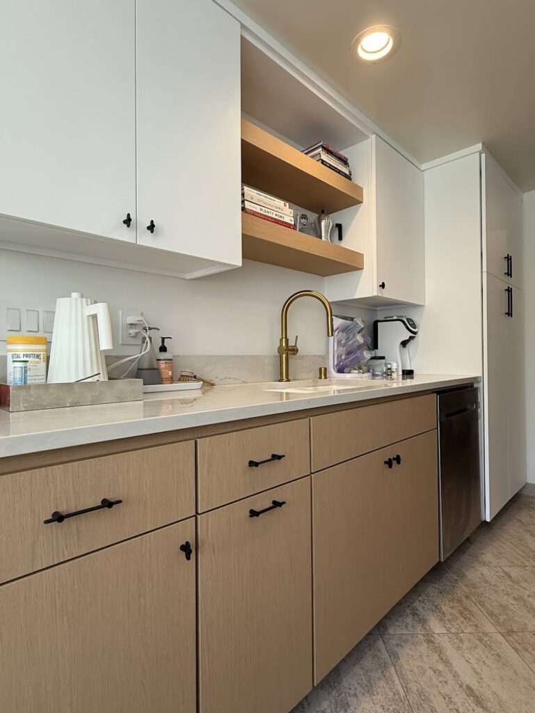 which cabinets above kitchen counter and light wooden drawers and cabinets below counter