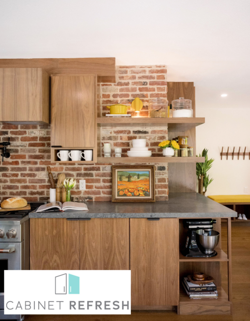 Warm rustic kitchen with wood cabinetry, exposed brick, and open shelving.